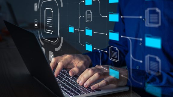Process Discovery a person working on a laptop with an graphic representation of process discovery