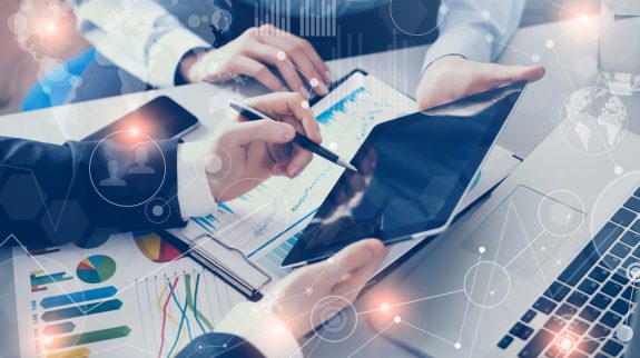 Business people meeting with technology Business people meeting with technology in office, visual interfaces effects